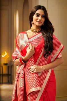 A Red Floral Woven Saree. It has intricate design all over the saree. This saree is a suitable amalgamation of style and grace that is required from an ethnic wear. The saree is ideal for any formal gathering. The saree comes with an unstitched blouse of corresponding color and design as shown in the picture. Fabric Type: Soft Banarasi SilkColor: ﻿RedSaree Length: 6.3 meters including 0.8 meter blouseBlouse Material: Cotton SilkWashing Instructions: Dry Clean Only Red Color Party, Sequence Blouse, Indo Western Gown, Saree Petticoat, Kurtis Tops, Full Sleeve Blouse, Saree Jewellery, Color Party, Lehenga Skirt