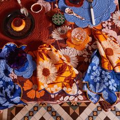 an overhead view of a table with plates and napkins