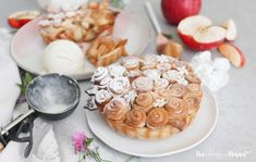 an apple pie and other desserts on plates