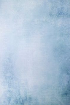 an abstract blue and white background with grungy paint on the bottom right corner