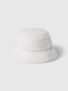 Soft, cozy sherpa bucket hat.  Flutter brim.  This hat is made with 50% recycled polyester.  Compared to virgin materials, using recycled materials helps to reduce resource use and waste.  This product was made in a factory that runs the Gap Inc.  P. A. C. E.  Personal Advancement & Career Enhancement) program.  P. A. C. E.  is our educational program that helps the women who make our clothes build the skills, knowledge, confidence & resilience needed to advance in work & life.  Learn more here.  For more fit and sizing info, check out our Size Guide. Sherpa Bucket Hat, Gap Kids, Work Life, Girl With Hat, The Gap, Recycled Materials, Size Guide, Bucket Hat, Gap