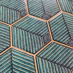 close up view of blue and green hexagonal tiles