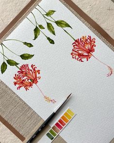 a watercolor painting of flowers on paper