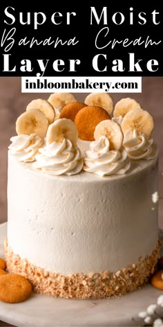 there is a cake with bananas on top and white frosting in the middle, surrounded by cookies