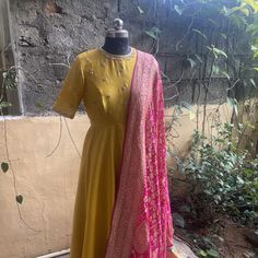 Hand embroidered yellow Anarkali with pink banarasi bandhej dupatta / anarkali suit set / anarkali dupatta USA / khaddi georgette dupatta / Indian dresses/ voggish / yellow  anarkali dress          Looking for a perfect indian dress/anarkali/suit sets that are trendy, unique and easy to carry !! yess, You are at the right place. we carry such versatile pieces of anarkalis and suit sets that really let you stand out in any occassion !!      featuring this beautiful pure chanderi dress in mustard Yellow Slub Silk Dupatta With Dabka Work, Yellow Slub Silk Churidar For Festivals, Yellow Slub Silk Anarkali Set With Dupatta, Yellow Slub Silk Unstitched Suit With Straight Kurta, Yellow Slub Silk Anarkali Set With Pallu, Traditional Yellow Slub Silk Anarkali Set, Yellow Raw Silk Anarkali Set With Dabka Work, Yellow Slub Silk Kurta With Pallu Detail, Yellow Slub Silk Kurta With Pallu