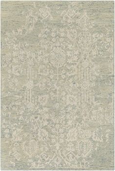 a large rug with an intricate design on the top and bottom, in light green tones