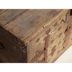 an old wooden box with holes in it