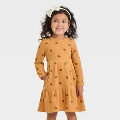 Get your darling ready for the day in cozy style by dressing them in this Cozy Dress from Cat & Jack™. This long-sleeve dress features a tiered design with a textured for sweet style. Plus, it comes with side pocket to help keep their hands warm while providing extra space for small items. Made from cotton-recycled polyester blend fabric with lining and added spandex, this pullover-style dress offers them comfortable all-day wear. Cat & Jack™: Designed for all children so you can trust it's made Playful Long Sleeve Dresses For Fall, Playful Long Sleeve Winter Dresses, Dresses Winter, Toddler Dresses, Cozy Dress, Cozy Style, Kids Dresses, Unisex Dress, Long Sleeve Knit Dress