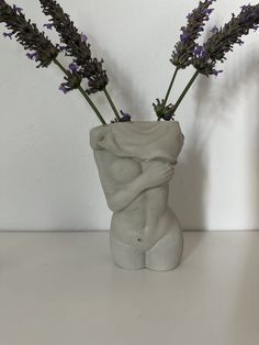 there is a vase with some flowers in it