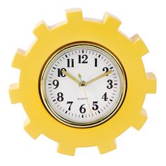 a yellow clock with white face and numbers on the front is against a white background