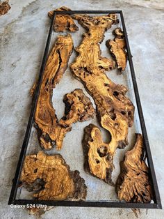 the wood is cut into pieces and placed in a metal frame