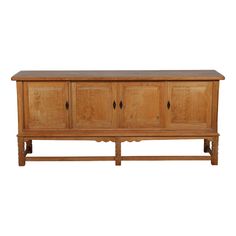 a wooden sideboard with four doors and three drawers