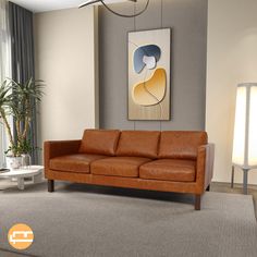 a living room with a brown leather couch and large painting on the wall behind it