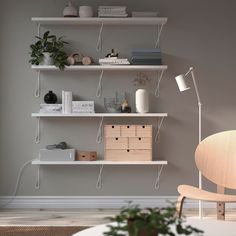 a living room with some shelves on the wall