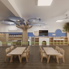 the interior of a children's playroom with wooden tables and chairs in it