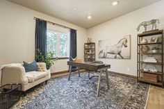 a living room filled with furniture and a rug