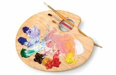 an artist's palette with paints and brushes