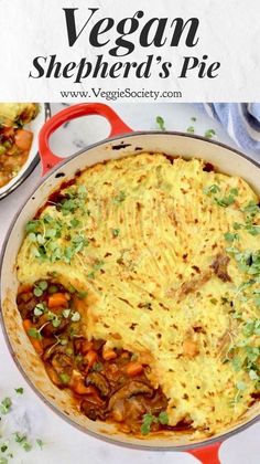 an omelet with meat and vegetables in a red skillet on a white table