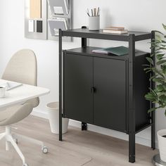 a black cabinet sitting next to a white desk