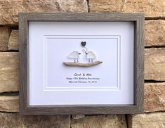 two birds in a boat with the words count & me written on it, framed in a wooden frame