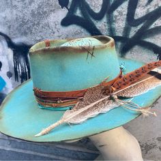 This Is A Pale Vintage Trail Ridge Hat That’s Been Dyed, Distressed, Burned And Etched. It Has A Buckskin Band With Lotus Flowers Etched On It’s Surface. There Is Another Lotus Flower Heat Etched Onto The Crown. The Size Is 6 7/8 Which Is 21 1/2-5/8” And Considered A Small.