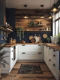 a kitchen with wooden walls and white cabinets, potted plants on the counter top