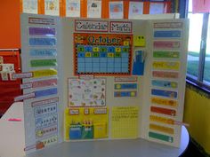 a bulletin board with calendars on it