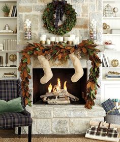 a living room with a fireplace decorated for christmas