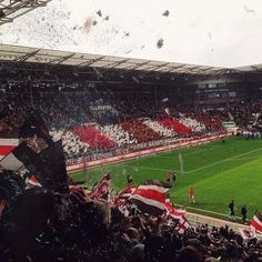 a soccer stadium filled with lots of people