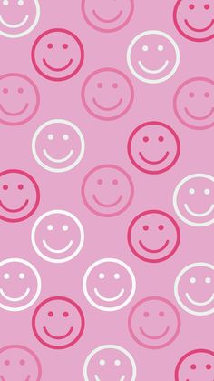 a pink background with white circles and smiling faces