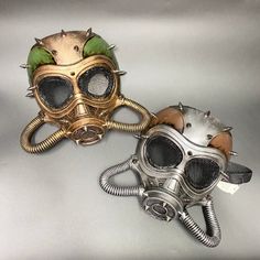 Hard molded plastic mask with studs, gears, and tubes. Black elastic strap in the back for a snug fit. Choose gold or silver. Non-medical. Steampunk Gas Mask, Plastic Mask, Diesel Punk, Gas Mask, Costume Mask, Post Apocalypse, Plastic Molds, Dieselpunk, Costume Accessories