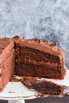 a chocolate cake with one slice missing from it