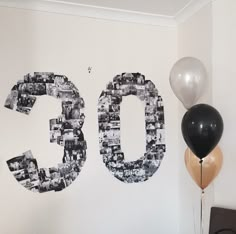 the number 50 is made out of photos and balloons in front of a white wall