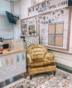 a chair sitting on top of a rug in front of a whiteboard with words