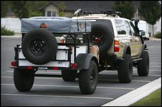 an off - road vehicle is parked in a parking lot