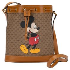 Gucci Disney bucket bag featuring a print of a Mickey Mouse. The bag comes with an adjustable shoulder strap measures 22”. Its new and comes with booklets and original dustcover. Handbag Outlet, Vuitton Bag, Stylish Bag, Printed Bags, Disney Mickey Mouse, Disney Mickey, Fashion Handbags, Drawstring Bag, Bucket Bag