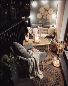 a living room filled with furniture and candles