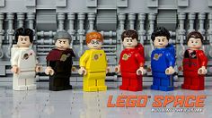 the lego space characters are lined up in front of an assembly line with machinery behind them