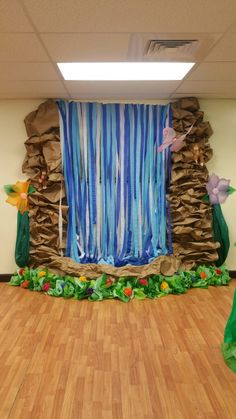 an office decorated with paper streamers and flowers