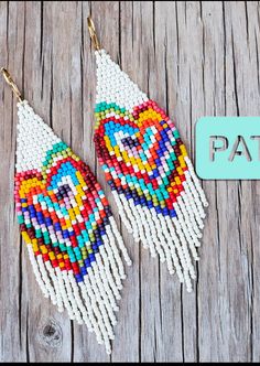 two pairs of beaded earrings with the word pat written on it and an image of a