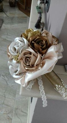 a bridal bouquet sitting on top of a chair