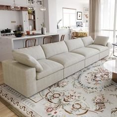 a living room filled with furniture and a large rug