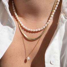 *Buy 2 items, Get 15% OFF your order. Coupon applied at checkout.* Luxurious freshwater pearl necklace. Carefully hand selected cultured fresh water pearls. Pearls are delicate by nature, so handle with care. Our Pearl necklaces are great for wearing by itself or layering. Also makes for the perfect gift! - 18k gold filled - Freshwater pearls - Water resistant / Tarnish resistant / Hypoallergenic - 1 year warranty Pearl Strand Necklace: - Pearl strand thickness: 3.6mm - Adjustable chain 16 to 18 Pearl Necklace Combination, Layered Necklaces With Pearls, Necklace Layering Pearls, Gold Pearl Necklace Set, Pearl Necklace Combo, Pearl And Gold Necklace Layering, Layering Pearl Necklaces, Everyday Pearl Charm Necklace For Mother's Day, Styling Pearls