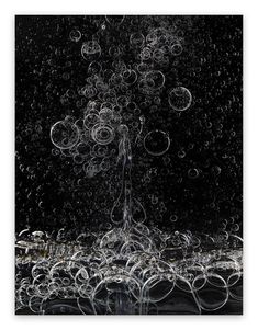 an abstract photograph of bubbles floating in the air