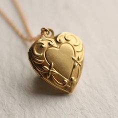 This beautiful vintage locket is a simple heart shape with an ornate Art Nouveau border, the perfect size for either an adult or child.  The locket measures only 25mm (one inch) across and is made from solid brass.  The size of this pendant means it can be worn by an adult or a child.  I make each necklace to order and this necklace is available in a choice of chain lengths.  Please refer to my illustration for a guide to how these lengths might look when worn.  For girls under ten years, I woul Art Nouveau Border, Nouveau Border, Book Locket Necklace, Engraved Locket, Vintage Locket, Silk Purse, Book Locket, No Thanks, Heart Locket Necklace