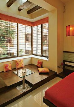 a living room filled with furniture and windows