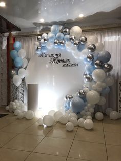 an arch made out of balloons with the words welcome to mr and mrs on it