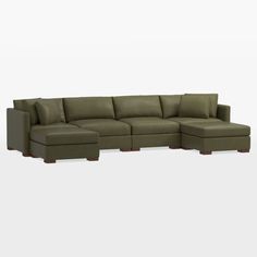 a large sectional couch with pillows on the top and bottom, sitting in front of a white background