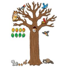 a tree with animals and birds on it, surrounded by cutouts from different shapes