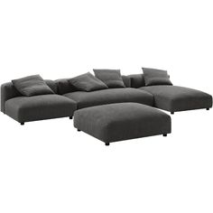 a large gray couch with pillows on it and a footstool next to it